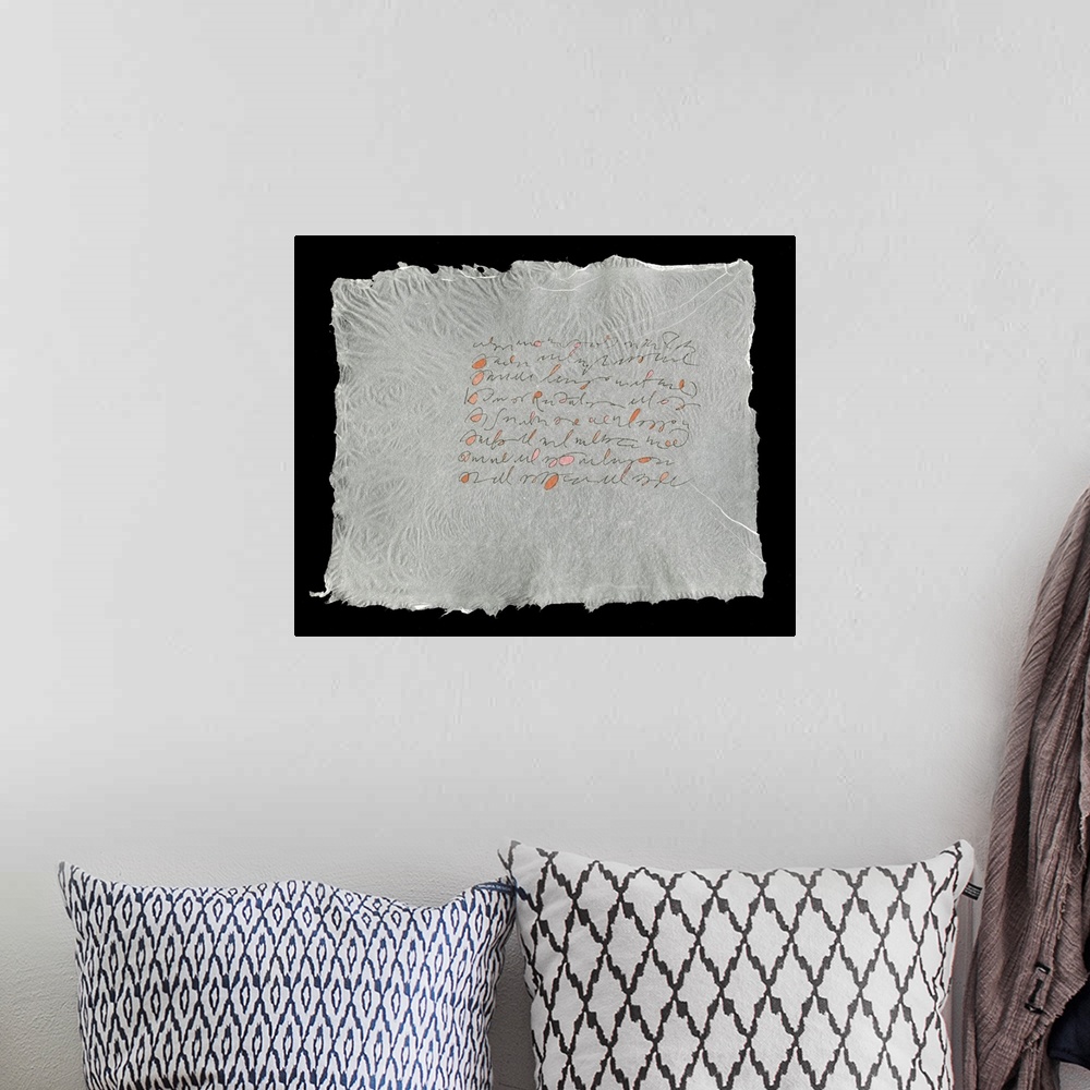 A bohemian room featuring Lines evoking handwriting set in a block on a sheet of handmade paper.
