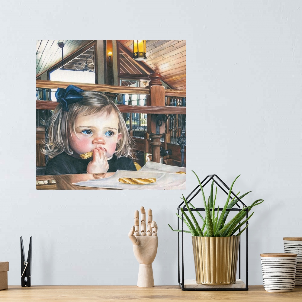 A bohemian room featuring A watercolor contemporary painting of a small child sitting at a table to eat.