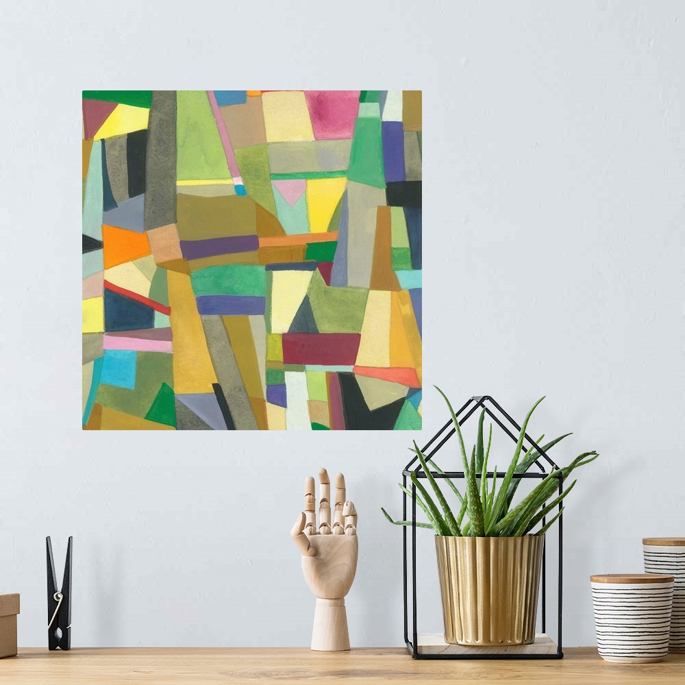 A bohemian room featuring One painting in a series of geometric abstracts with some various colors depicting the artist's i...