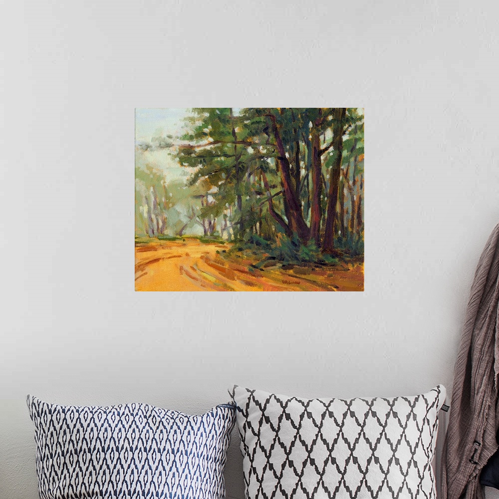A bohemian room featuring A contemporary painting of a small country road framed by a forest.