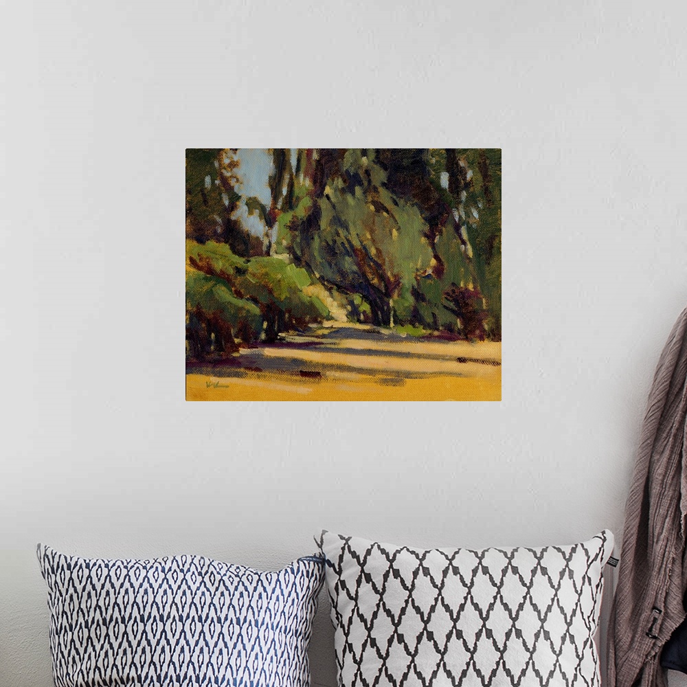 A bohemian room featuring A contemporary painting of a small divide in a forest.