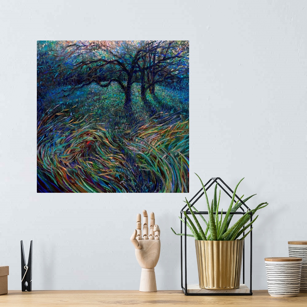 A bohemian room featuring Brightly colored contemporary artwork of trees in a field.