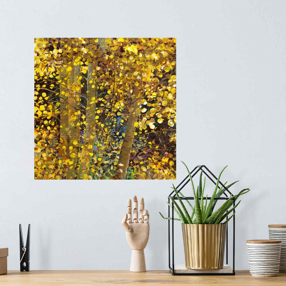 A bohemian room featuring Brightly colored contemporary artwork of yellow trees.
