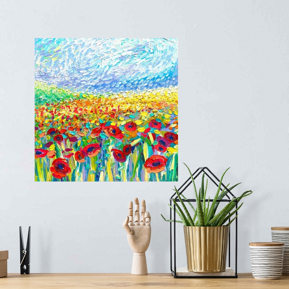 A bohemian room featuring Brightly colored contemporary artwork of a painting of a field of red and yellow poppies.