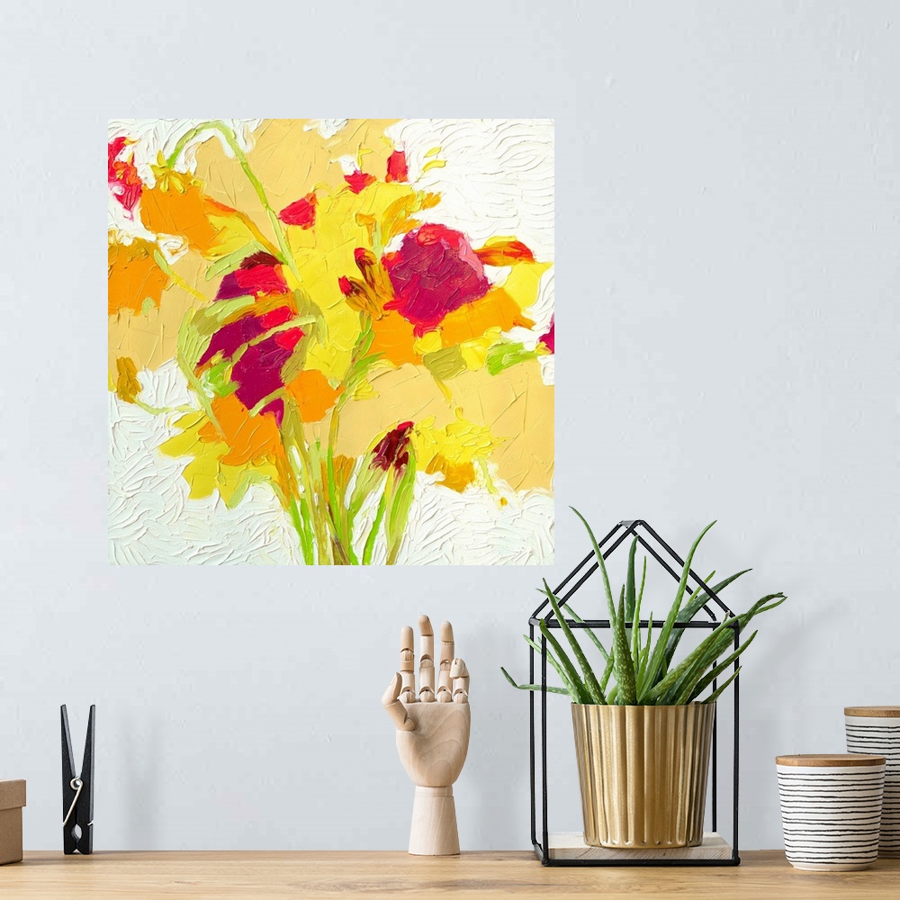 A bohemian room featuring Brightly colored contemporary artwork of a red, yellow, and orange flowers.