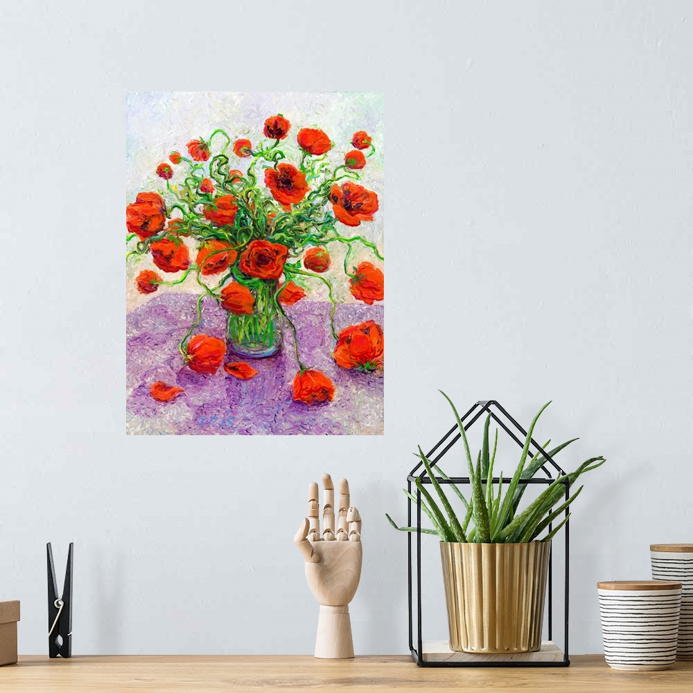 A bohemian room featuring Brightly colored contemporary artwork of red poppies in a vase.