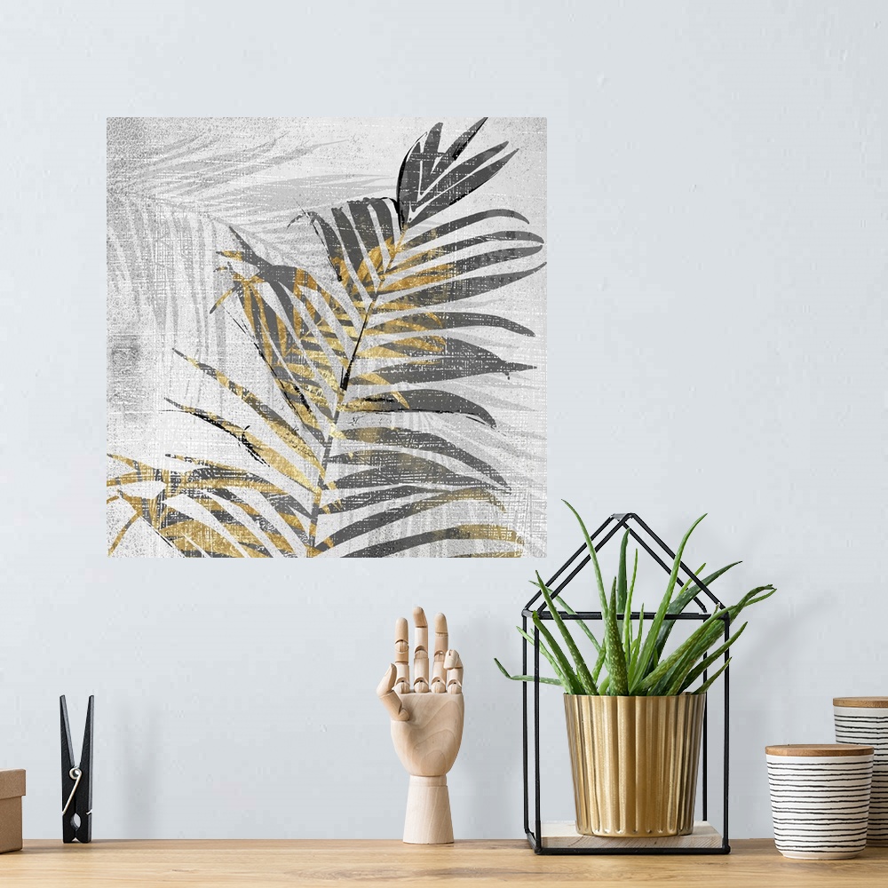 A bohemian room featuring A square artistic image of a gold and gray fern leaves with a fade leaf in the background with wh...
