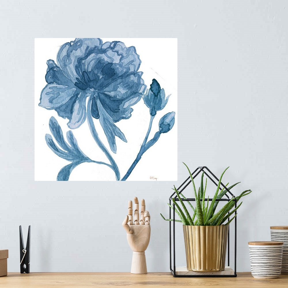 A bohemian room featuring A blooming flower and two small buds in blue tones.