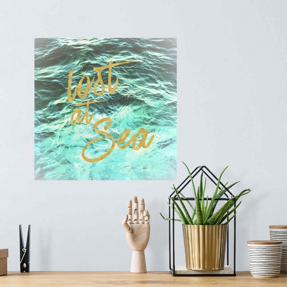 A bohemian room featuring "Lost at Sea" in golden script over an image of rippling ocean waves.