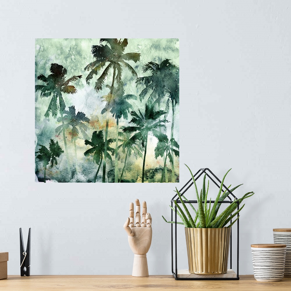A bohemian room featuring A square watercolor painting of a group of palm trees in shades of green.