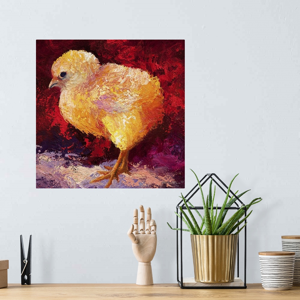 A bohemian room featuring Brightly colored painting of a newborn chick with vibrant red and orange tones.
