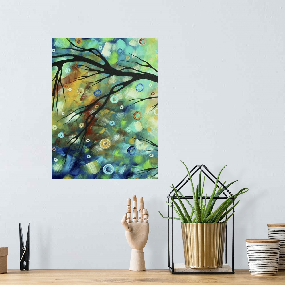A bohemian room featuring Tall abstract painting of patches of color with the silohuette of a branch over top.