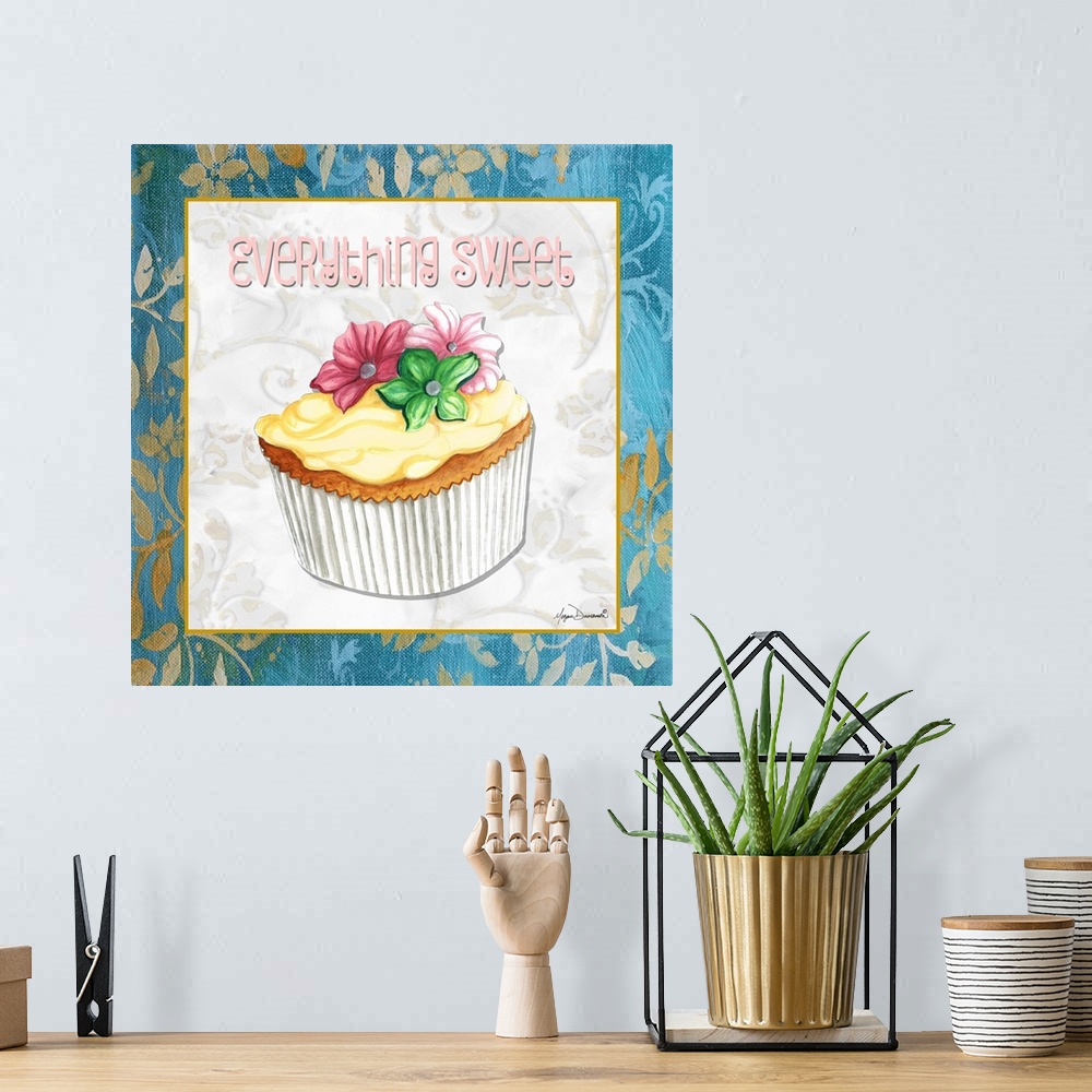 A bohemian room featuring A square panel featuring a cupcake decorated with three flowers and vanilla frosting.