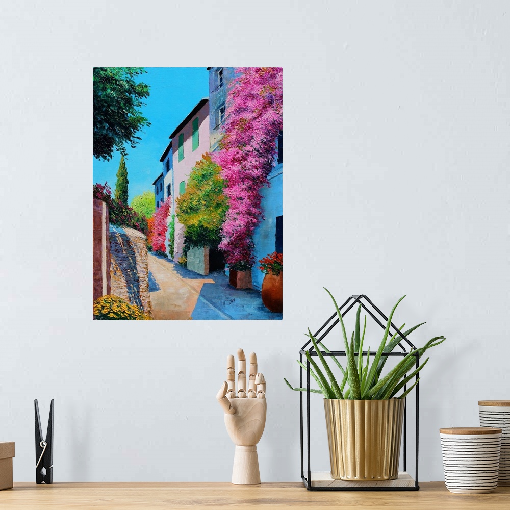 A bohemian room featuring Contemporary painting of a rural village covered in bright flowers.