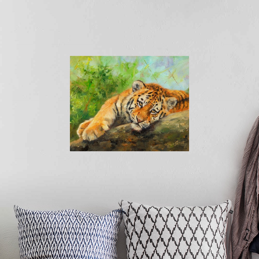 A bohemian room featuring Contemporary painting of a tiger cub lazily laying on a rock.