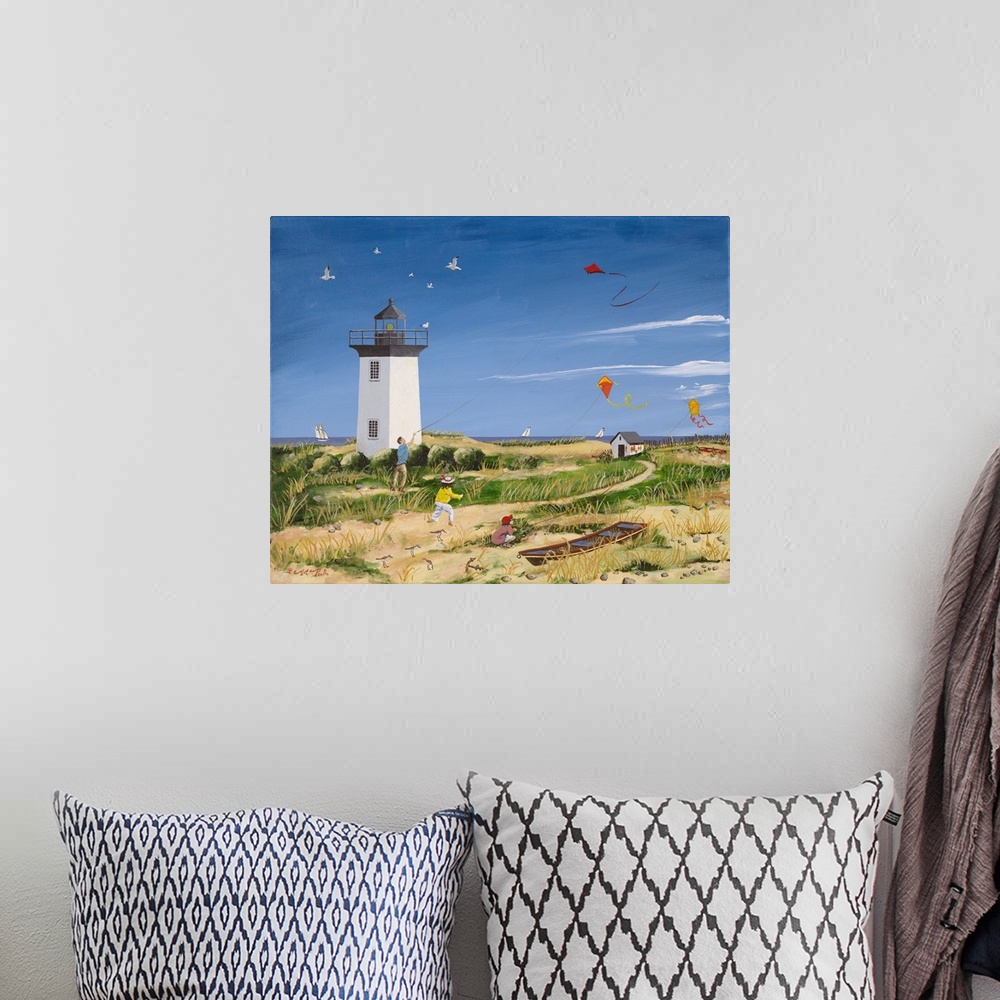 A bohemian room featuring Americana scene of children flying kites near a small lightouse on the beach.