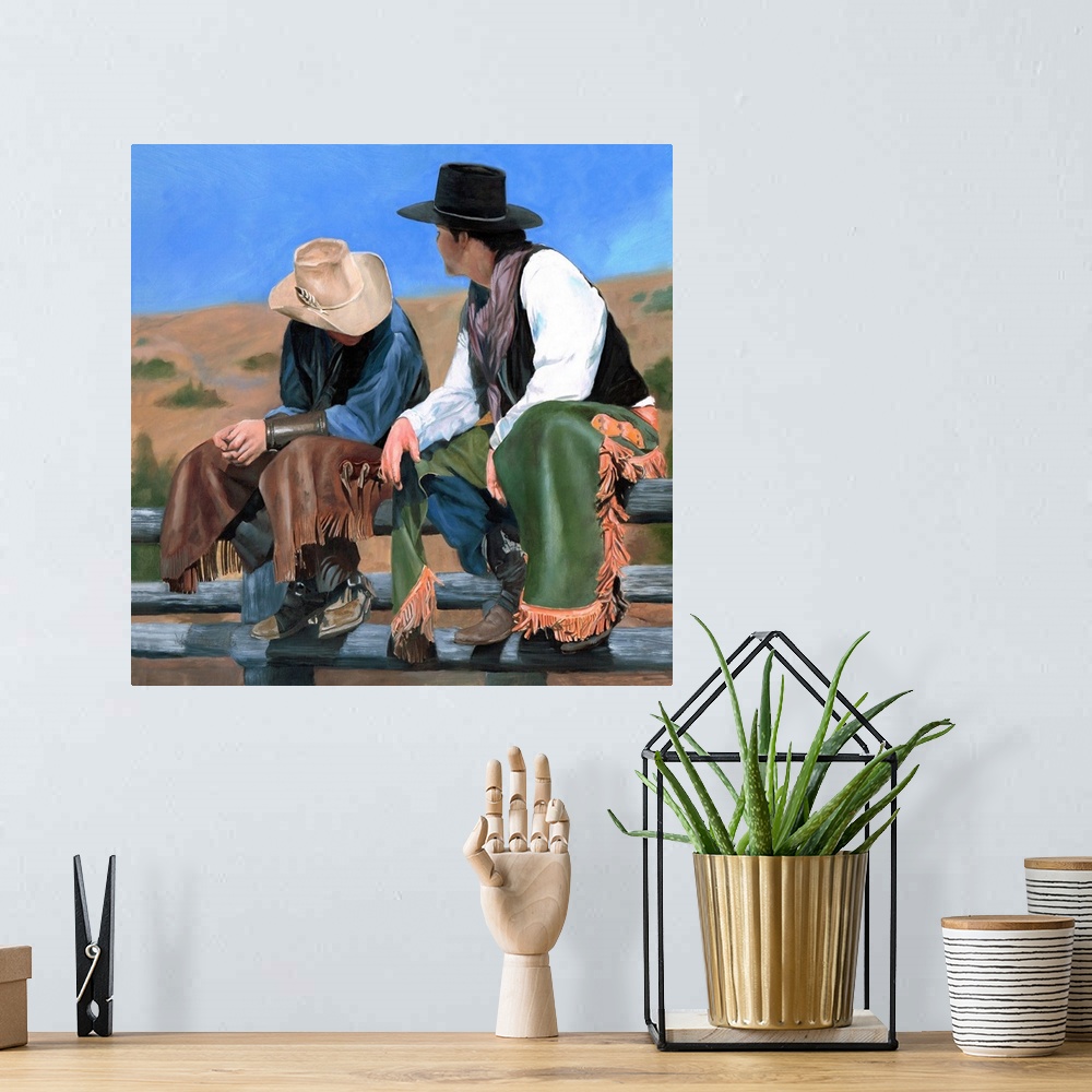 A bohemian room featuring Painting of two cowboys wearing chaps and sitting on a wooden fence.