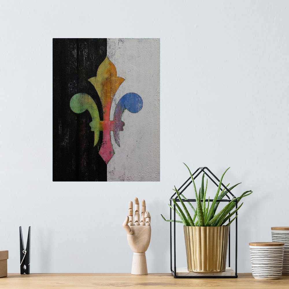 A bohemian room featuring A contemporary painting of a colorful symbol against a split black and white background.