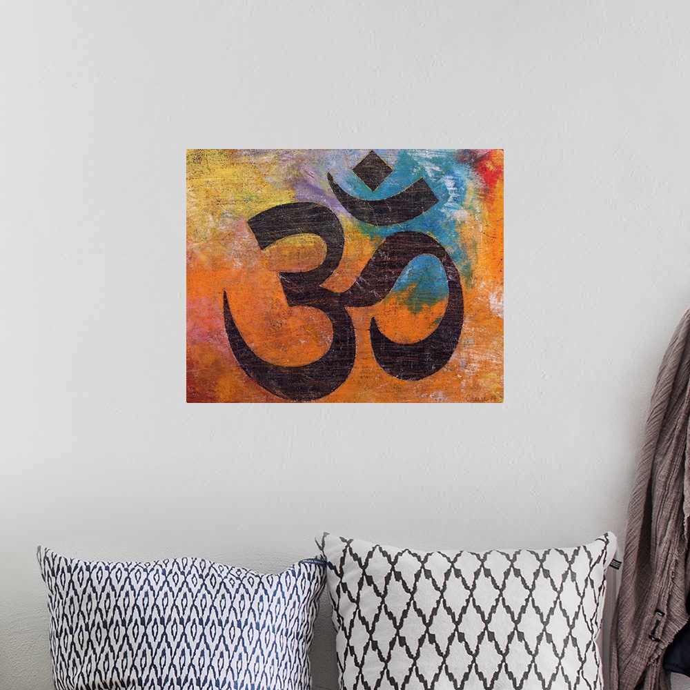 A bohemian room featuring A contemporary painting of an Om against a colorful background.