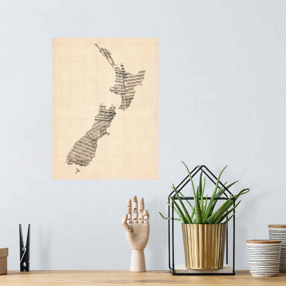 A bohemian room featuring A map of New Zealand made from a collage of old and vintage sheet music, including some handwritt...