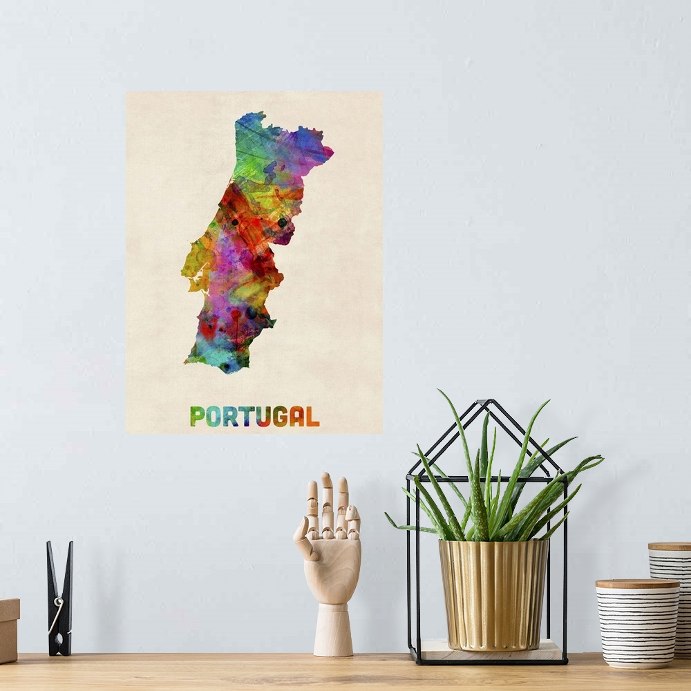 A bohemian room featuring Contemporary piece of artwork of a map of Portugal made up of watercolor splashes.