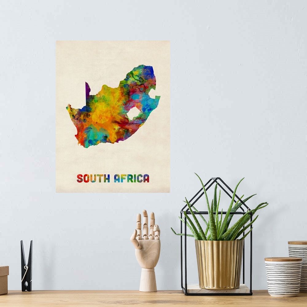 A bohemian room featuring A watercolor map of South Africa.