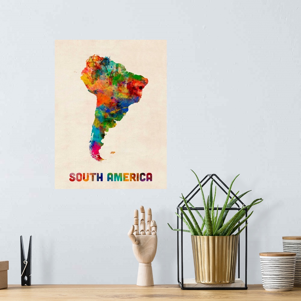 A bohemian room featuring A watercolor map of South America.