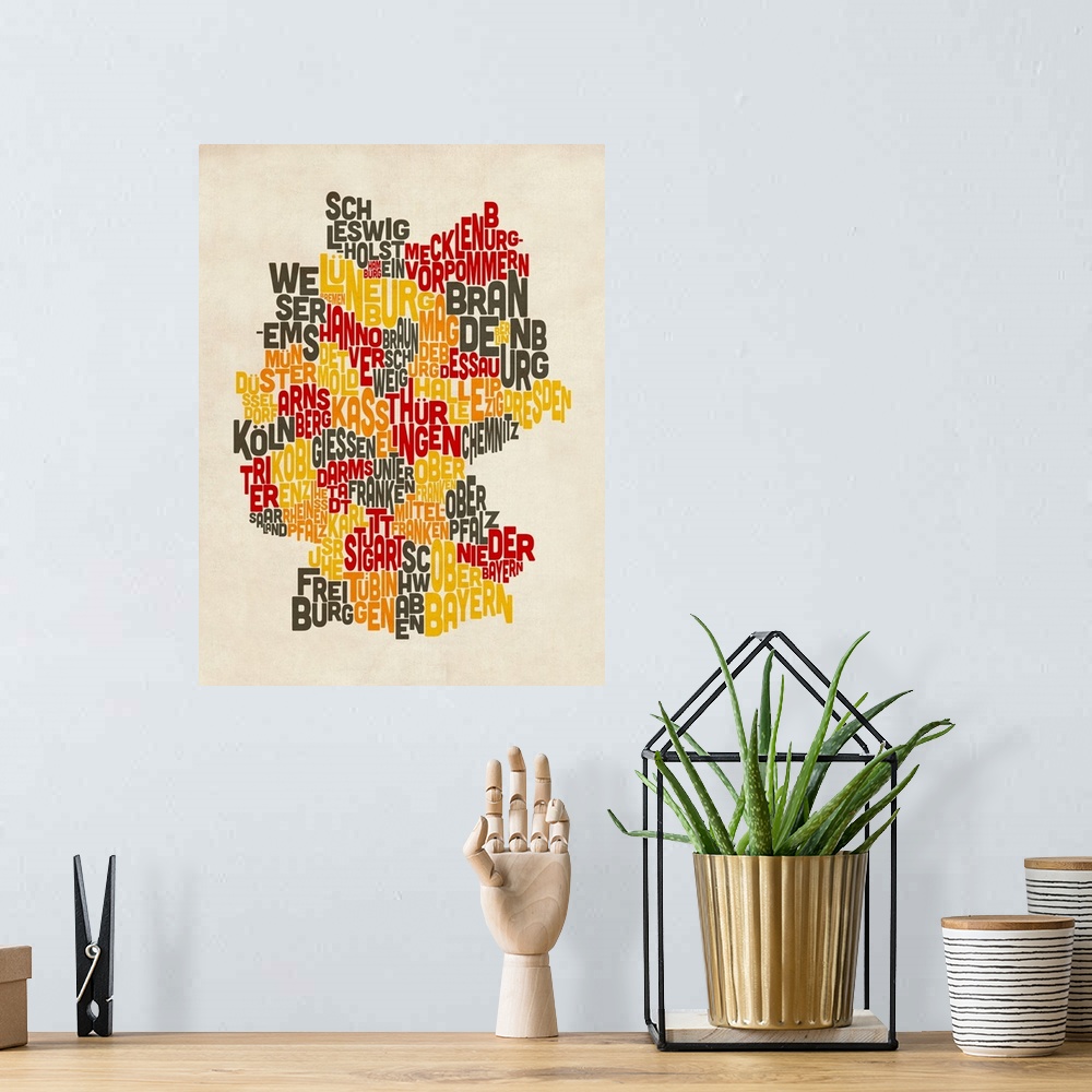 A bohemian room featuring Typography art map of Germany against a weathered beige background.