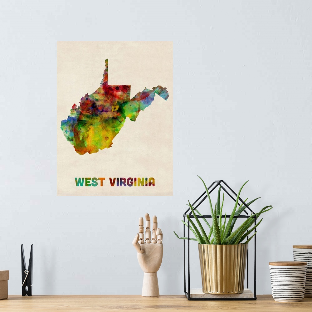 A bohemian room featuring Contemporary piece of artwork of a map of West Virginia made up of watercolor splashes.