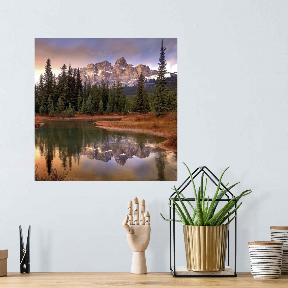A bohemian room featuring Castle Mountain and boreal forest reflected in lake, Banff National Park, Alberta