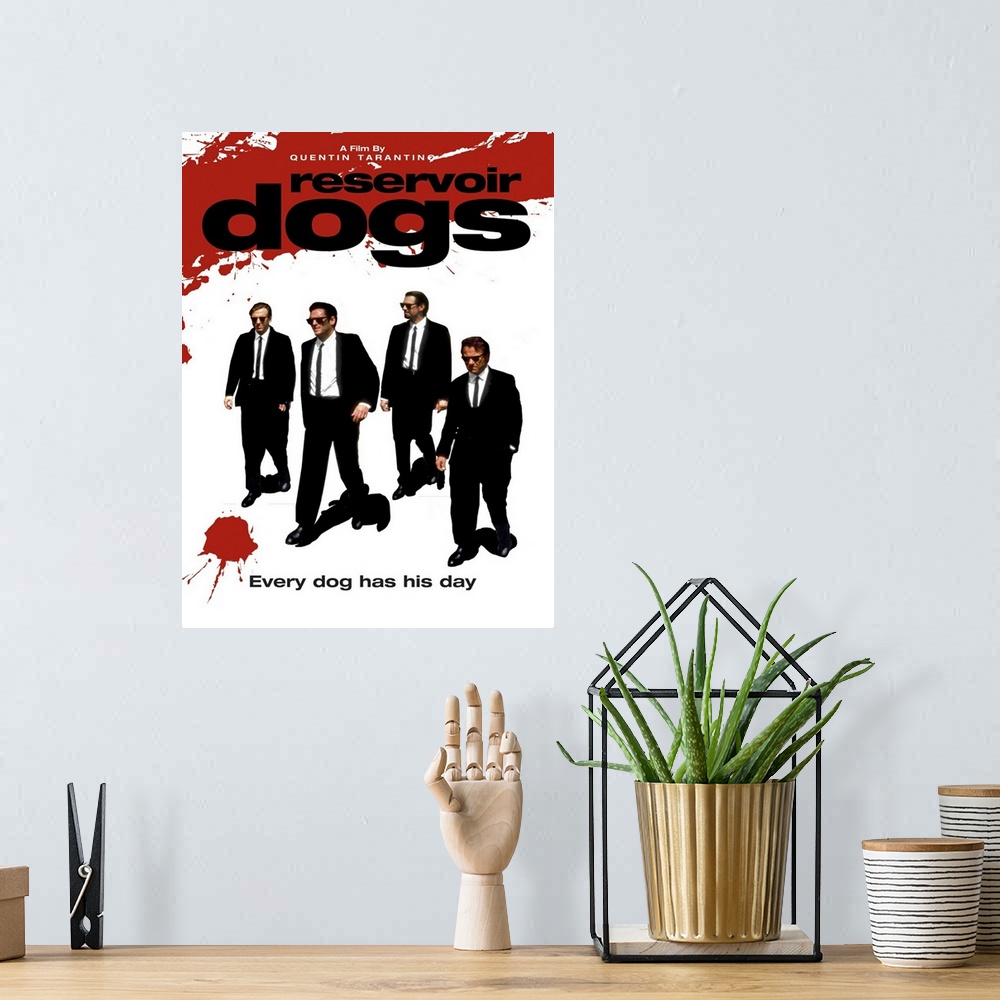 A bohemian room featuring Movie poster for "Reservoir Dogs". It has the four main characters walking in suits with splashes...