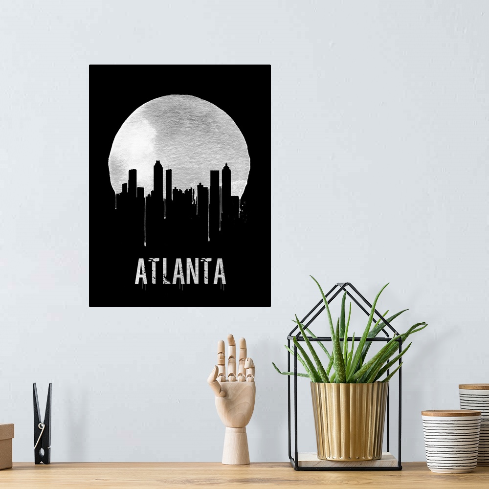 A bohemian room featuring Contemporary watercolor artwork of the Atlanta city skyline, in silhouette.