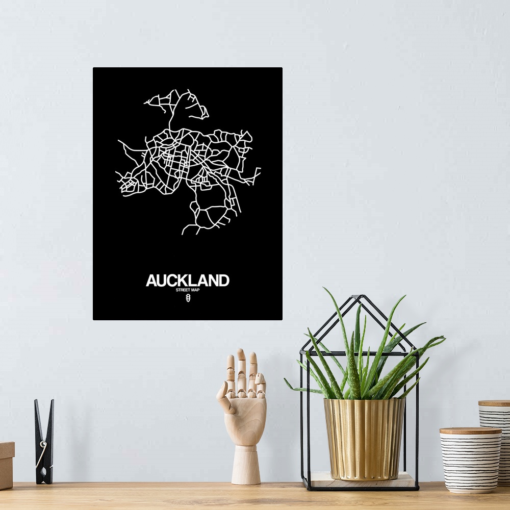 A bohemian room featuring Minimalist art map of the city streets of Auckland in black and white.