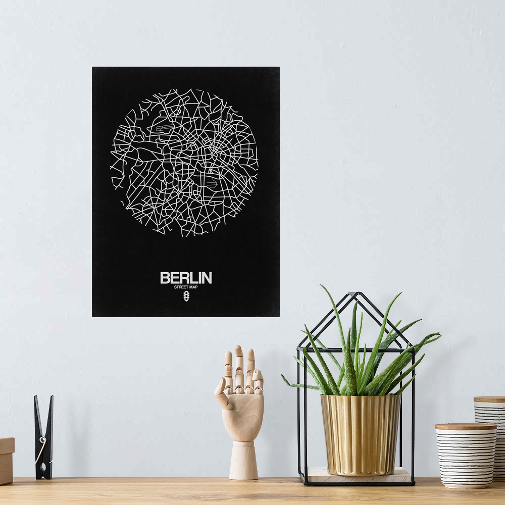 A bohemian room featuring Minimalist art map of the city streets of Berlin in black and white.