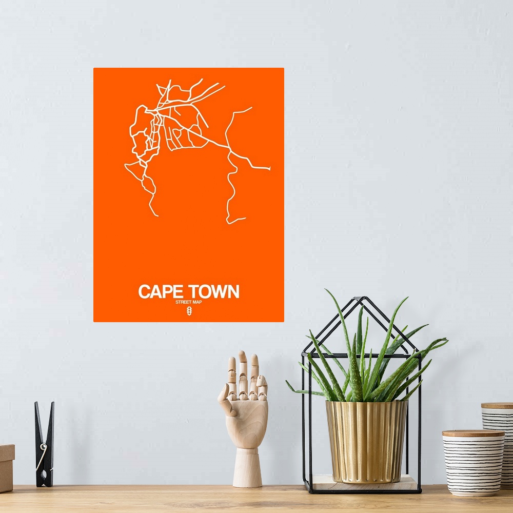 A bohemian room featuring Minimalist art map of the city streets of Cape Town in orange and white.