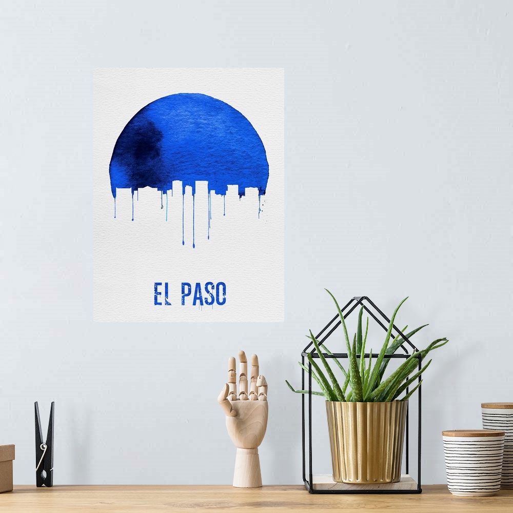 A bohemian room featuring Contemporary watercolor artwork of the El Paso city skyline, in silhouette.