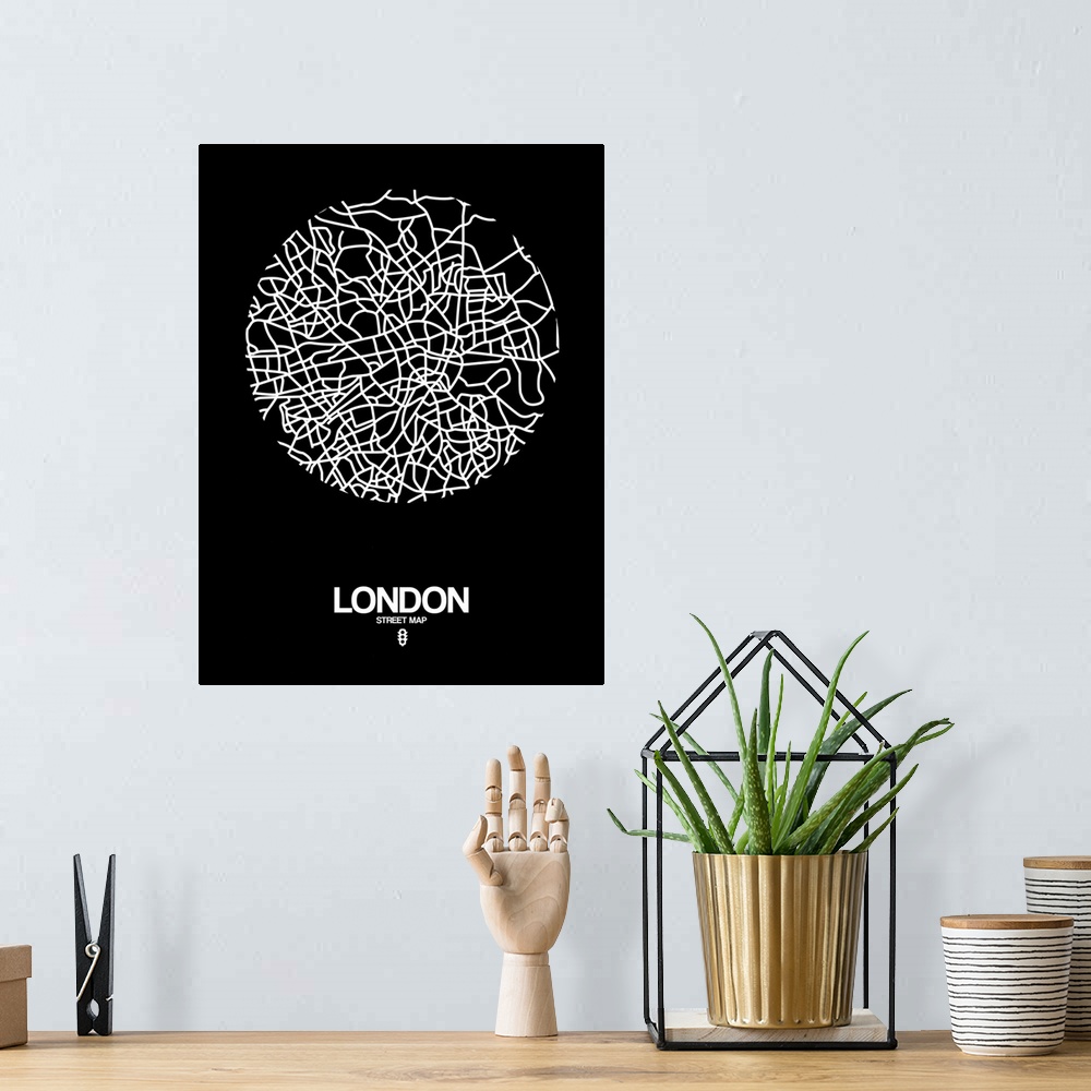 A bohemian room featuring Minimalist art map of the city streets of London in black and white.