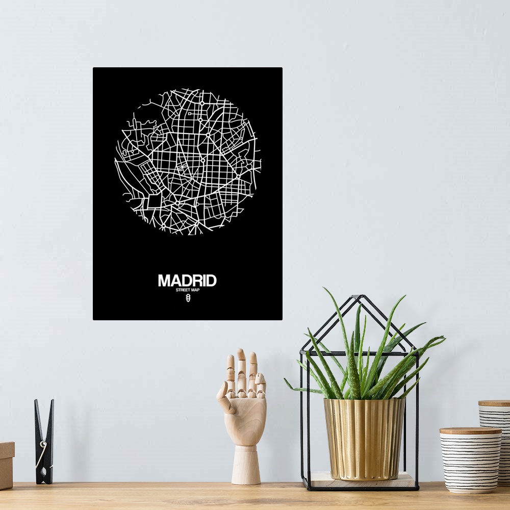 A bohemian room featuring Minimalist art map of the city streets of Madrid in black and white.