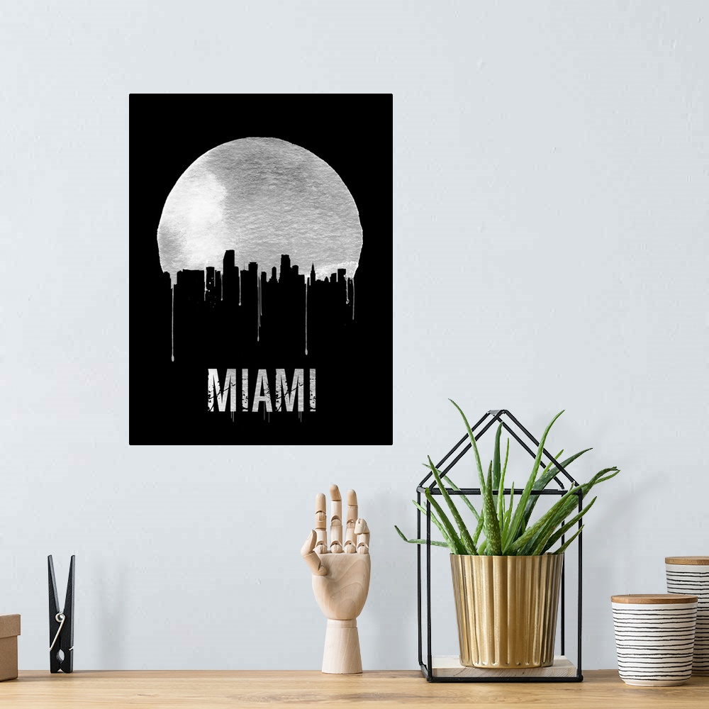 A bohemian room featuring Contemporary watercolor artwork of the Miami city skyline, in silhouette.