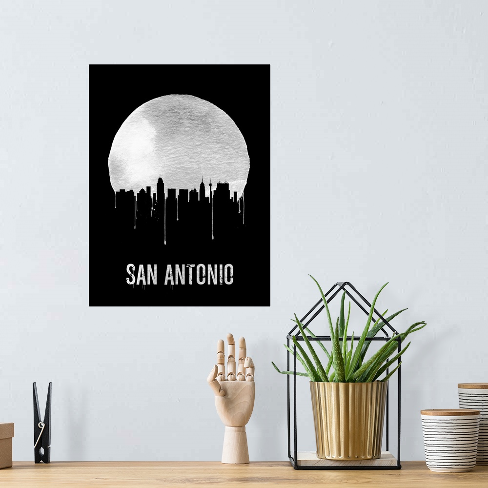 A bohemian room featuring Contemporary watercolor artwork of the San Antonio city skyline, in silhouette.