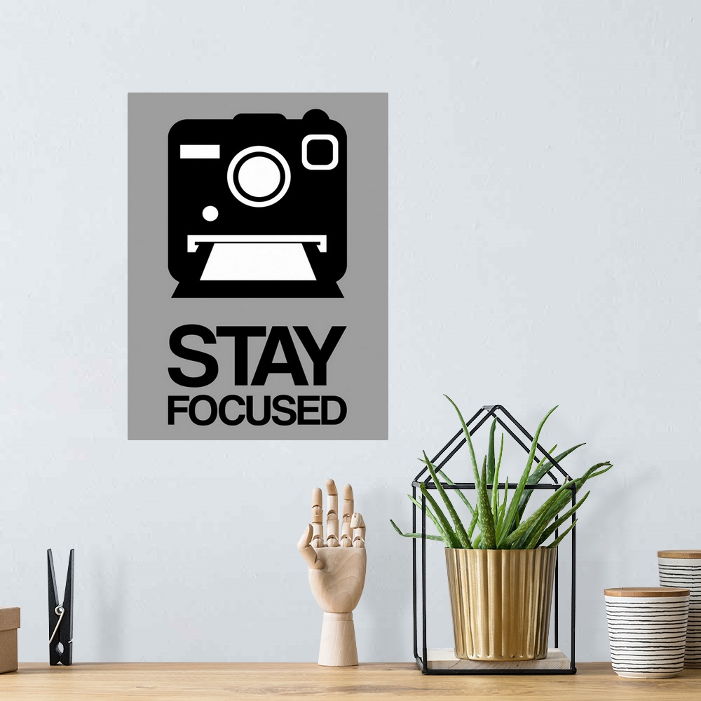 A bohemian room featuring Stay Focused Polaroid Camera Poster I