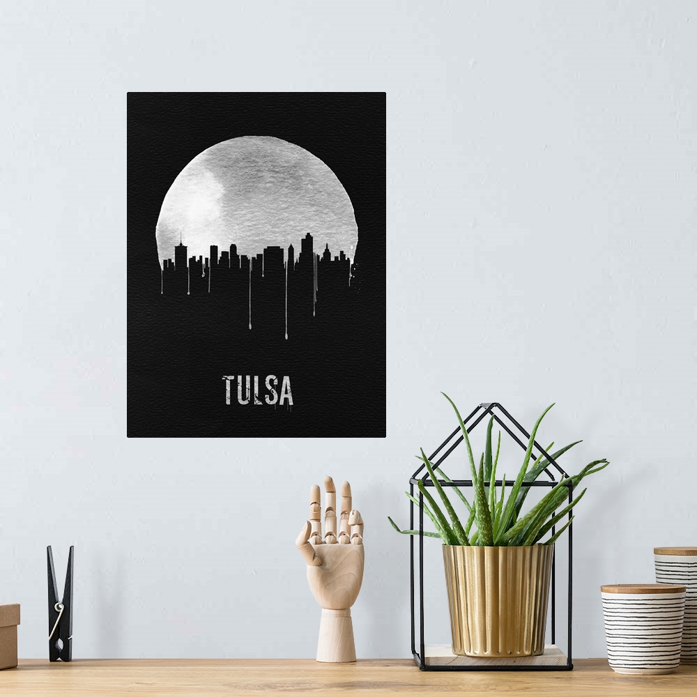 A bohemian room featuring Contemporary watercolor artwork of the Tulsa city skyline, in silhouette.