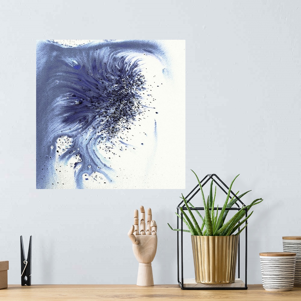 A bohemian room featuring Abstract artwork in blue splashes and drips and flowing paint.