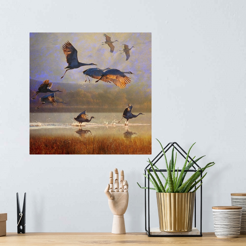A bohemian room featuring Contemporary artwork of a flock of cranes taking to flight.