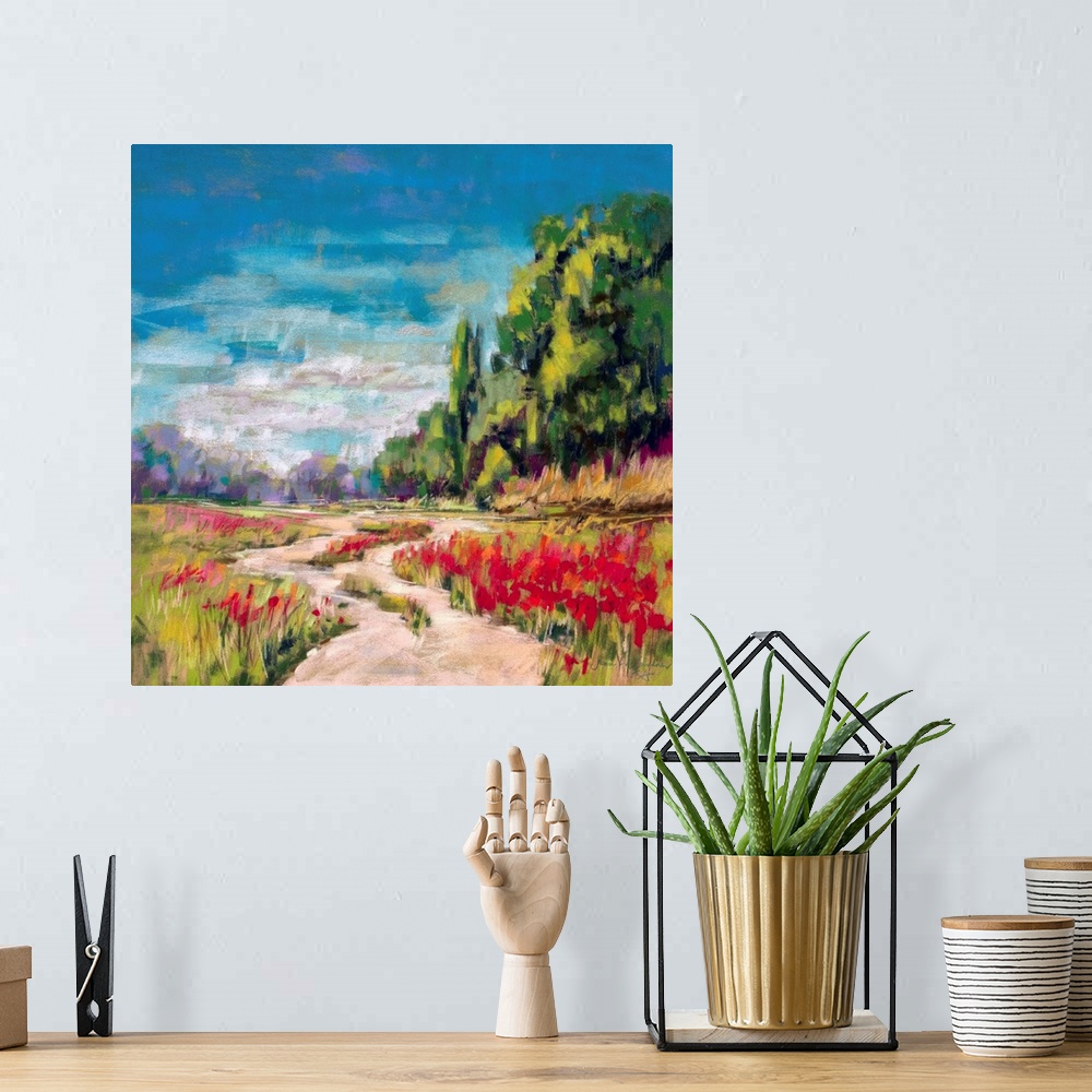 A bohemian room featuring Pastel landscape painting of English countryside with trees and poppies.