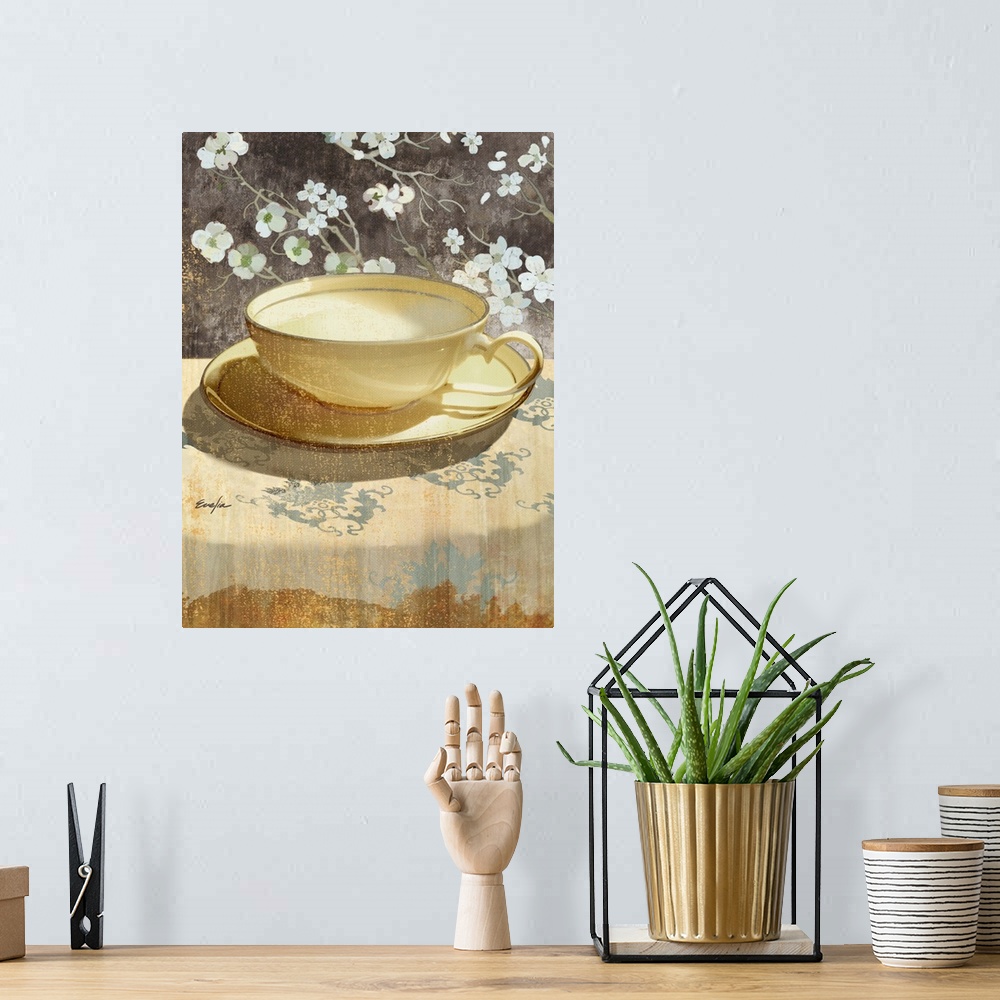 A bohemian room featuring Contemporary artwork of a golden teacup sitting on a floral tablecloth.