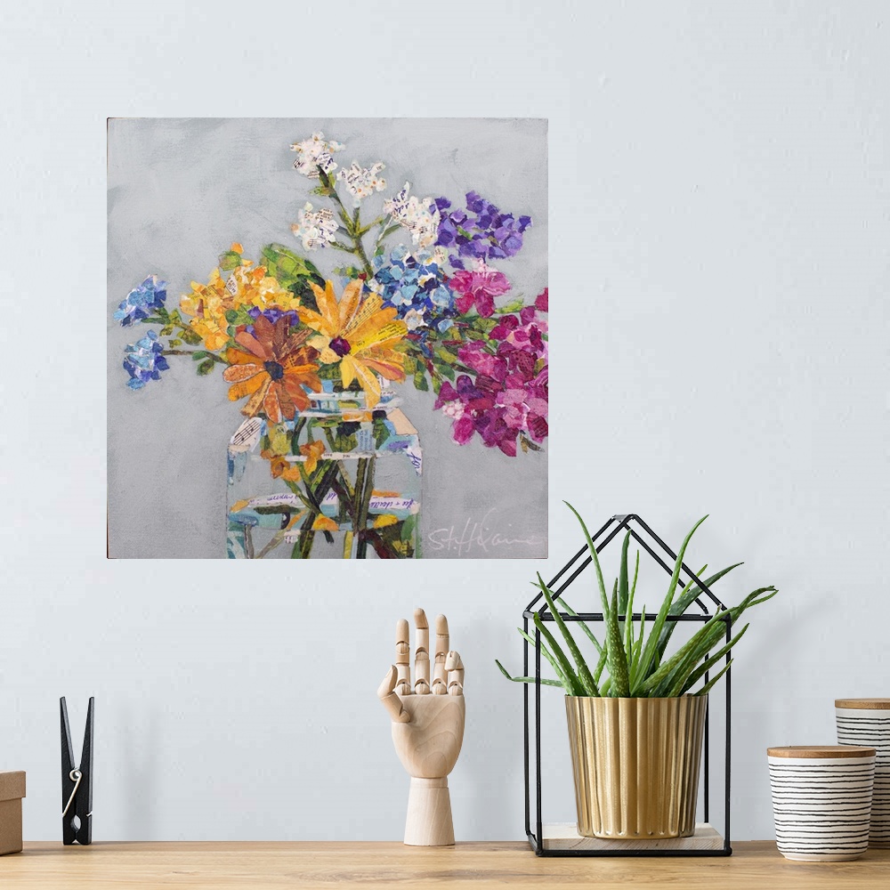A bohemian room featuring Mixed media collage of wildflowers of yellow, pink, purple, and white in a clear glass jar.