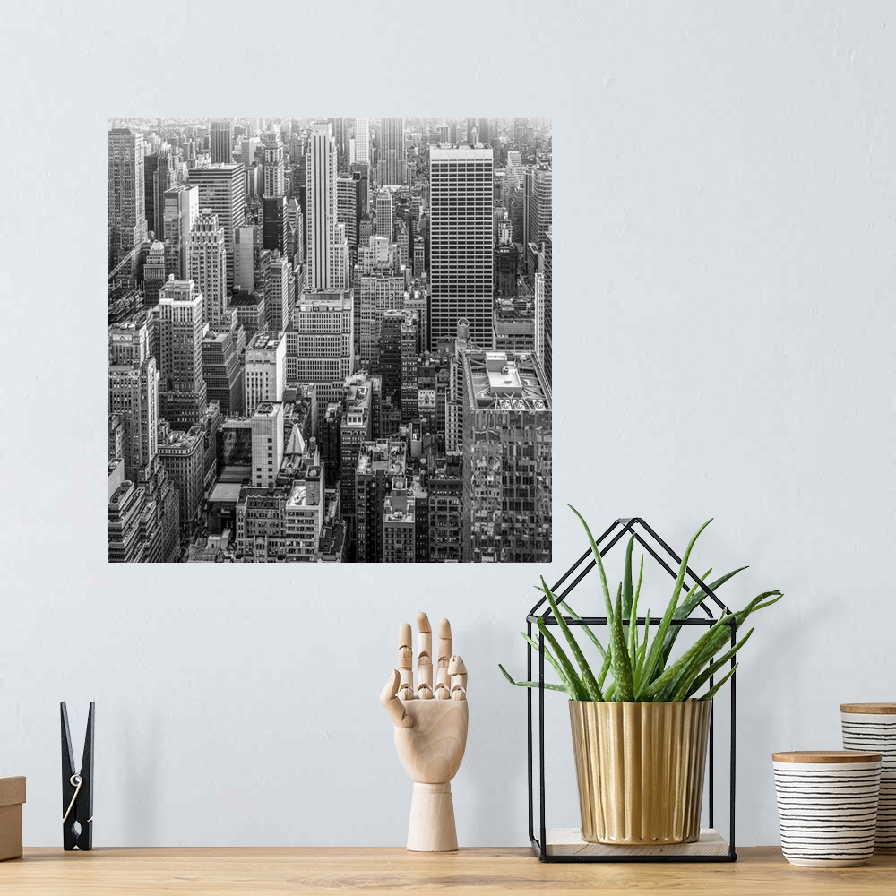 A bohemian room featuring A glimpse of the skyscrapers of New York in black and white to give the image a dramatic flair.