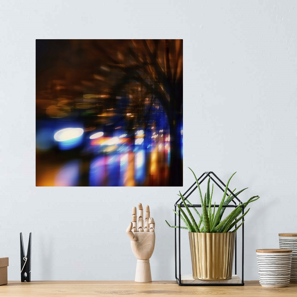A bohemian room featuring Lights from shops and cars in an urban environment at night, warped and blurred to create an abst...