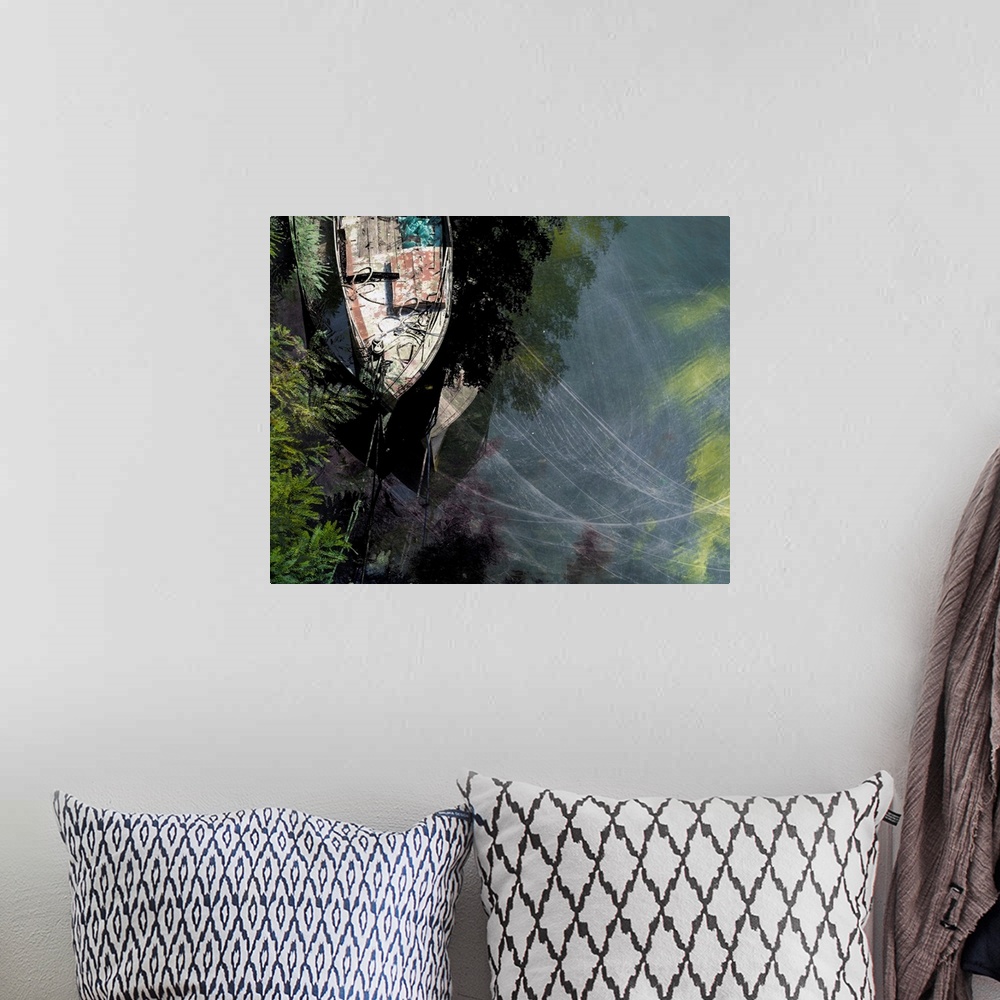 A bohemian room featuring Aerial photograph of a tied up boat on the water created with multiple exposures to show movement.